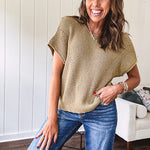 Olive woven drop shoulder sweater blouse with short sleeves and V shaped design n the front.
