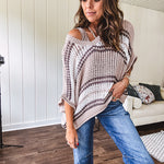 Soft open weave drop shoulder pullover with taupe, dark grey and white striping throughout, V neck design front and back and oversized fit.