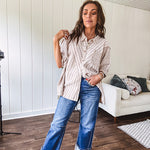 Oversized cotton blend khaki dolman style button front top with raw seams, cuffed short sleeves and dainty floral patterns in spice with mixed textures.