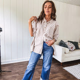 Oversized cotton blend khaki dolman style button front top with raw seams, cuffed short sleeves and dainty floral patterns in spice with mixed textures.