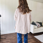 Oversized cotton blend khaki dolman style button front top with raw seams, cuffed short sleeves and dainty floral patterns in spice with mixed textures.