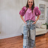 Teal and pink plaid denim-like pants with lace drawstring and patchwork and distressing throughout, raw hem and wide leg.