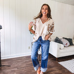 Oversized, lightweight stretchy beige ribbed top with a mix of wheat and dark tan crochet inserts and trim throughout with ivory crochet florals, hoodie and lace drawstring with lace at the wide hem and short sleeved cuffs.