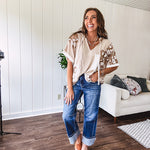 Oversized, lightweight stretchy beige ribbed top with a mix of wheat and dark tan crochet inserts and trim throughout with ivory crochet florals, hoodie and lace drawstring with lace at the wide hem and short sleeved cuffs.