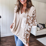 Oversized, lightweight stretchy beige ribbed top with a mix of wheat and dark tan crochet inserts and trim throughout with ivory crochet florals, hoodie and lace drawstring with lace at the wide hem and short sleeved cuffs.