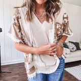 Oversized, lightweight stretchy beige ribbed top with a mix of wheat and dark tan crochet inserts and trim throughout with ivory crochet florals, hoodie and lace drawstring with lace at the wide hem and short sleeved cuffs.