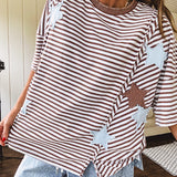Oversized terry knit short sleeved top with cream, espresso and light blue striping and star patches throughout with exposed seams down the sides of the front and a split front hem.
