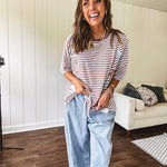 Light wash slouchy cropped barrel denim with elastic waist, seam details down the sides of the legs and side pockets.