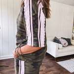 Thin, lightweight dark camo short sleeved top with light pink striping and lace detail at the sleeves.