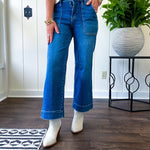 Stretchy medium wash utility style cropped denim with a high rise.