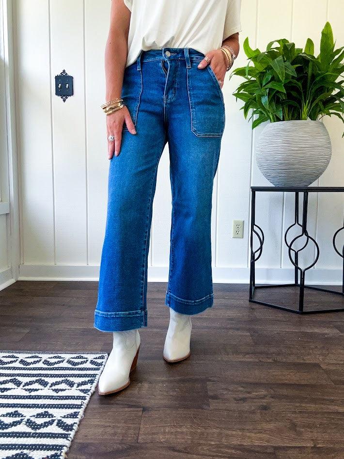 Stretchy medium wash utility style cropped denim with a high rise.