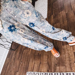 Washed navy thin, lightweight wide leg pants with taupe and navy florals throughout, metal floral button down closure, elastic back waist, elastic cuffs and side and oversized back pockets.