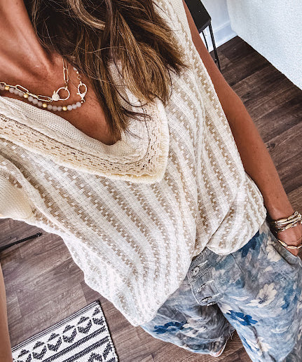 Cotton natural and khaki woven style V neck tank with lace and rope detail at the V neck and ivory trim at the sleeves with relaxed hem.