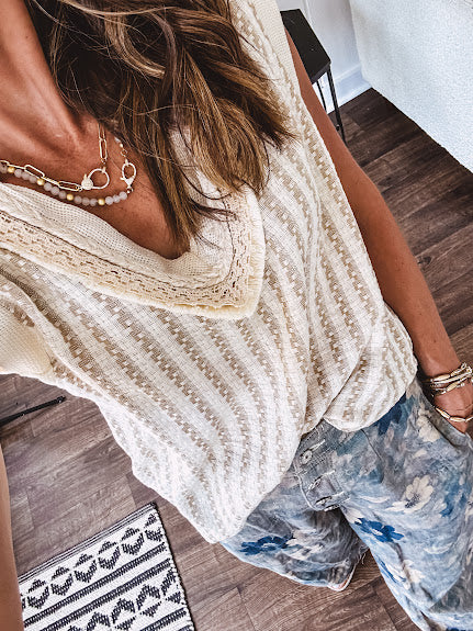 Cotton natural and khaki woven style V neck tank with lace and rope detail at the V neck and ivory trim at the sleeves with relaxed hem.
