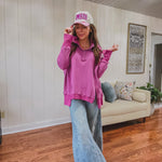 Orchid Henley top with snap button neck and collar and split front seam.