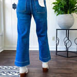 Stretchy medium wash utility style cropped denim with a high rise.