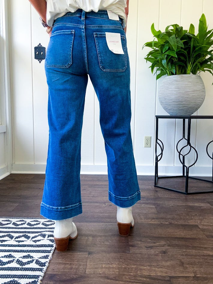 Stretchy medium wash utility style cropped denim with a high rise.