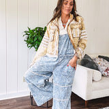 Vintage light wash denim and twill overalls with silver metal adjustable strap hardware, side zip, side and back pockets with ivory eyelet trim and cutouts throughout, wide leg design.