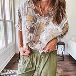 Lightweight and flowy beige patchwork printed tee with V neck, raw seams and cream lace inserts and floral crochet floral patch on the front pocket.