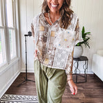 Lightweight and flowy beige patchwork printed tee with V neck, raw seams and cream lace inserts and floral crochet floral patch on the front pocket.