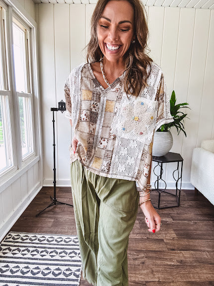 Lightweight and flowy beige patchwork printed tee with V neck, raw seams and cream lace inserts and floral crochet floral patch on the front pocket.