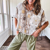Lightweight and flowy beige patchwork printed tee with V neck, raw seams and cream lace inserts and floral crochet floral patch on the front pocket.