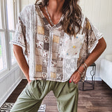 Lightweight and flowy beige patchwork printed tee with V neck, raw seams and cream lace inserts and floral crochet floral patch on the front pocket.