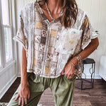 Lightweight and flowy beige patchwork printed tee with V neck, raw seams and cream lace inserts and floral crochet floral patch on the front pocket.