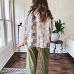 Lightweight and flowy beige patchwork printed tee with V neck, raw seams and cream lace inserts and floral crochet floral patch on the front pocket.