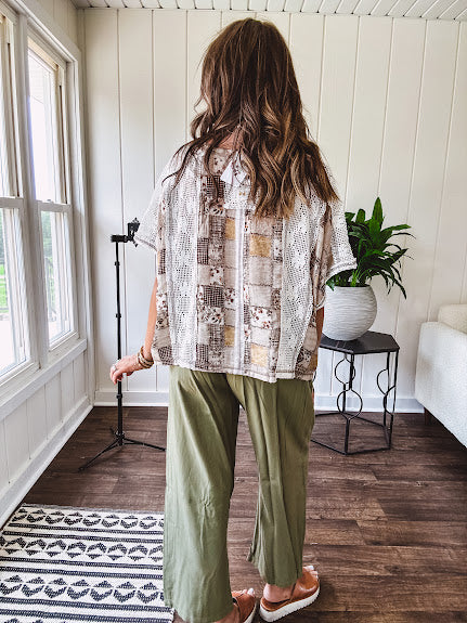 Lightweight and flowy beige patchwork printed tee with V neck, raw seams and cream lace inserts and floral crochet floral patch on the front pocket.