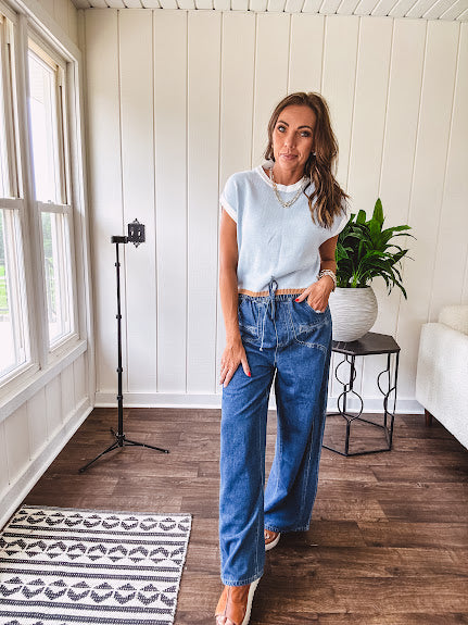 Light washed wide leg denim with front pockets, unique seam detail down the legs and drawstring waist.