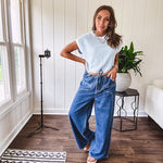 Light washed wide leg denim with front pockets, unique seam detail down the legs and drawstring waist.