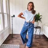 Light washed wide leg denim with front pockets, unique seam detail down the legs and drawstring waist.