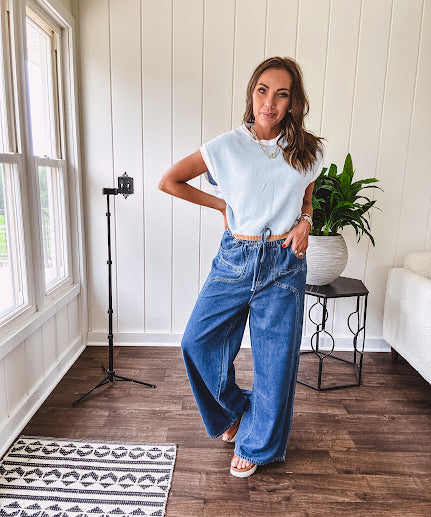 Light washed wide leg denim with front pockets, unique seam detail down the legs and drawstring waist.