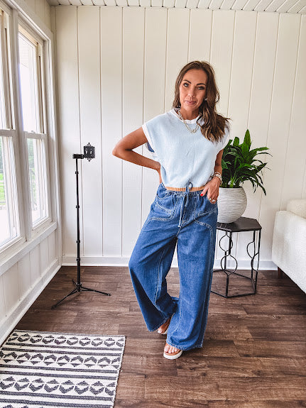 Light washed wide leg denim with front pockets, unique seam detail down the legs and drawstring waist.