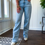 Light wash 90s dad jean with zero distressing and relaxed, straight leg design, finished hem.