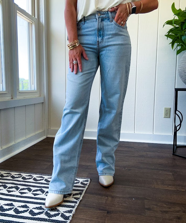 Light wash 90s dad jean with zero distressing and relaxed, straight leg design, finished hem.