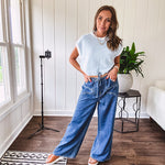 Light washed wide leg denim with front pockets, unique seam detail down the legs and drawstring waist.