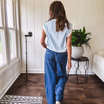Light washed wide leg denim with front pockets, unique seam detail down the legs and drawstring waist.