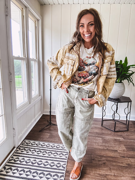 Soft oatmeal tee with retro inspired mushrooms in washed teal, red, spice and yellow with florals throughout and dotted with rhinestones.