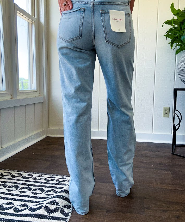 Light wash 90s dad jean with zero distressing and relaxed, straight leg design, finished hem.