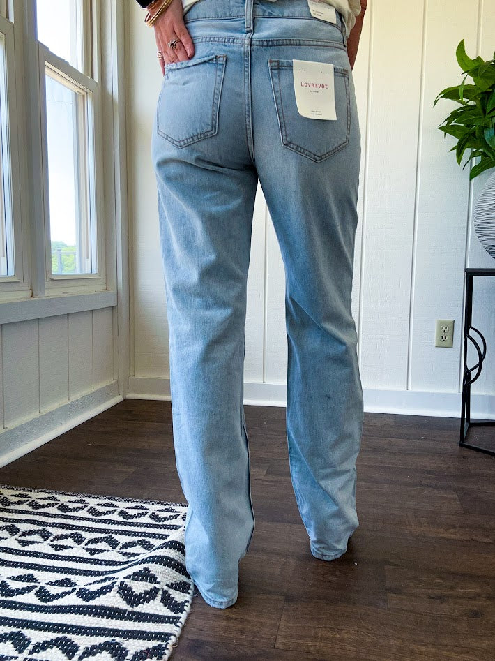 Light wash 90s dad jean with zero distressing and relaxed, straight leg design, finished hem.