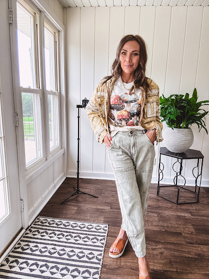 Soft oatmeal tee with retro inspired mushrooms in washed teal, red, spice and yellow with florals throughout and dotted with rhinestones.