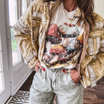 Soft oatmeal tee with retro inspired mushrooms in washed teal, red, spice and yellow with florals throughout and dotted with rhinestones.