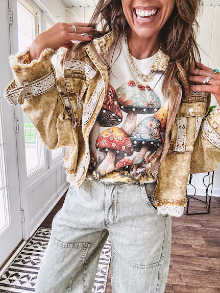 Soft oatmeal tee with retro inspired mushrooms in washed teal, red, spice and yellow with florals throughout and dotted with rhinestones.