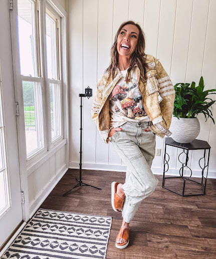 Mineral washed light olive denim barrel pants with carpenter design, side pockets and button and zipper closure with elastic back waist.
