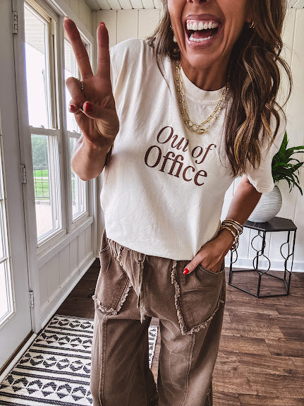 Cotton terry wide leg pants in medium brown with wide legs, exposed seams throughout, elastic drawstring waist and oversized pockets.
