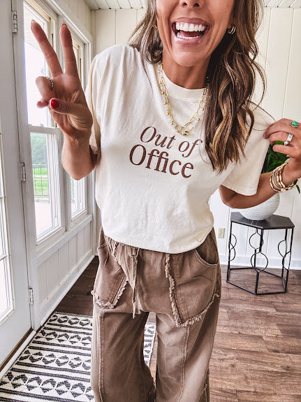 Cotton terry wide leg pants in medium brown with wide legs, exposed seams throughout, elastic drawstring waist and oversized pockets.