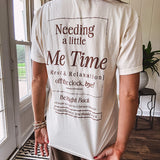 Ivory cotton tee featuring dark brown "Out of Office" and "Needing a Little Me Time Rest & Relaxation Office the Cock, 'bye!" graphics on the front and back.