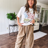 Lightweight mocha utility pant with textured darker mocha striping and contrasting tan and cream mini striping at the elastic drawstring waist and trim on the oversized pocket.